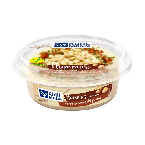 Hummus Topped with Pine Nuts and Spices in Plastic Container